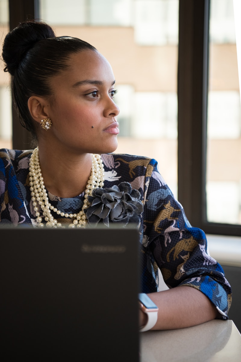 woman facing laptop
