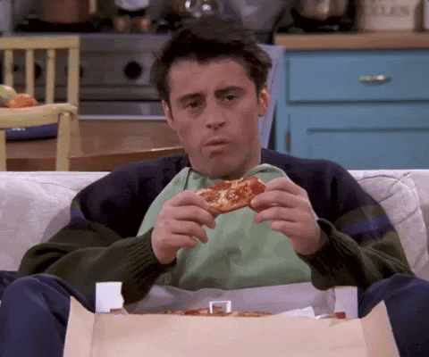 Joey de friends qui mange une pizza en disant i don't know