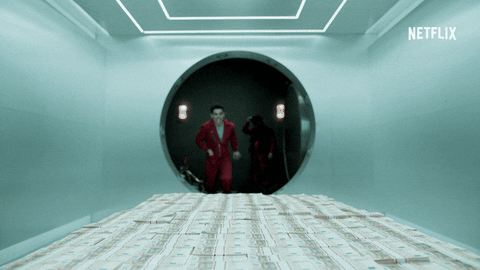 un personnage de la casa del papel qui saute dans une liasse de billets